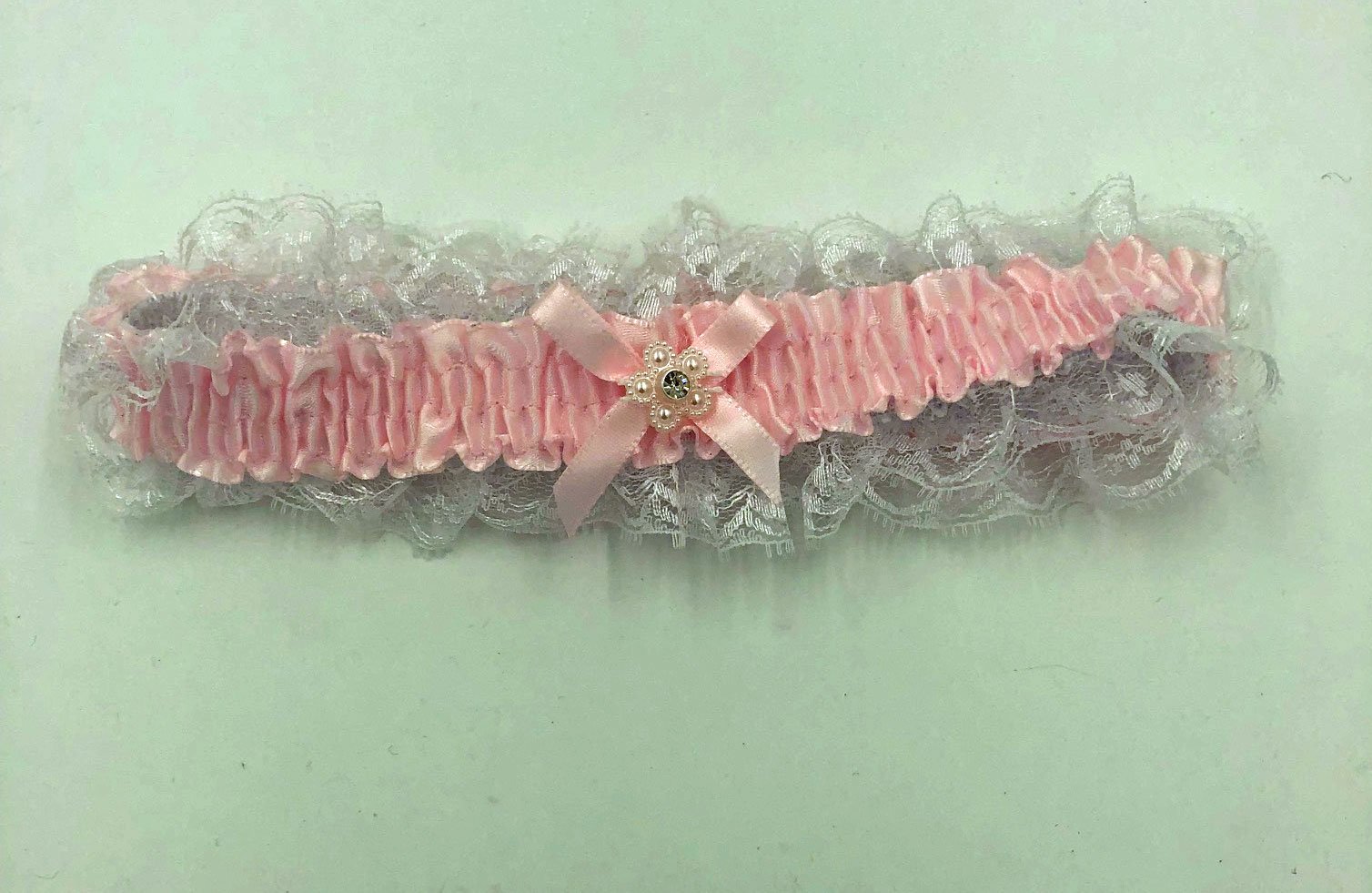 Ij0NNlMA2IGrIttLtGkjqD7uRg1OaSxi.jpg Satin Leg Garter - One Size - Baby Pink With White Lace - Image 1